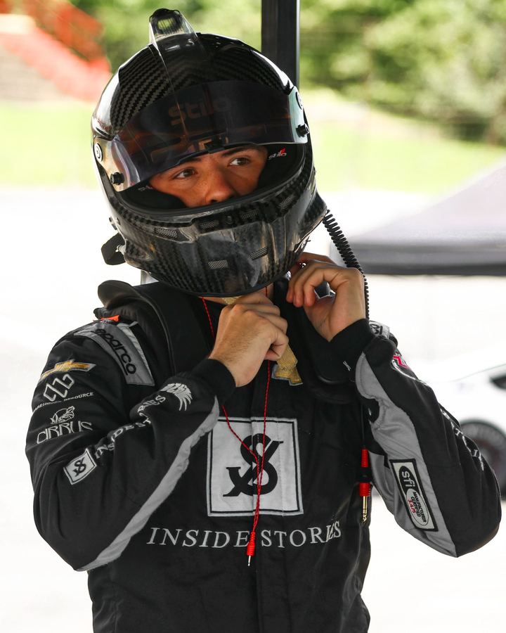 Jonah fastening his helmet in his firesuit