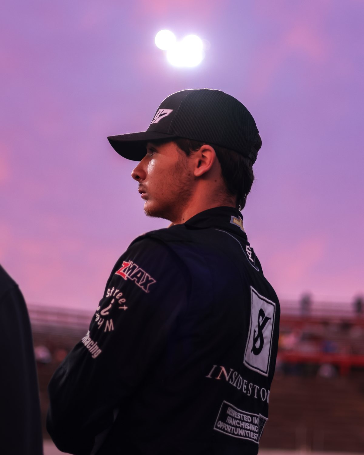 Jonah Cullen in profile against a purple sunset sky at Hickory